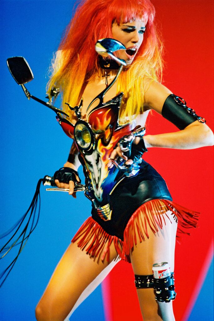 thierry mugler: Emma Sjöberg wearing a piece from Thierry Mugler’s SS 1992 collection on the set of George Michael’s Too Funky music video. W Magazine.
