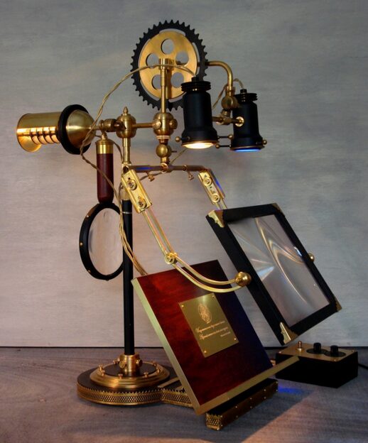 Art Donovan, The Ferryman, two-sided lamp for researcher and assistant, U.V. bulb, adjustable table, magnifiers, mahogany, brass. 